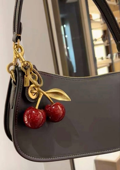 Coach cherry bag charm