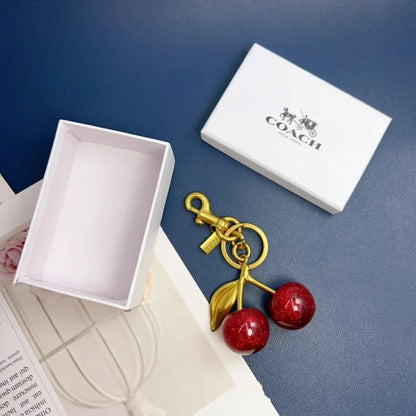 Coach cherry bag charm