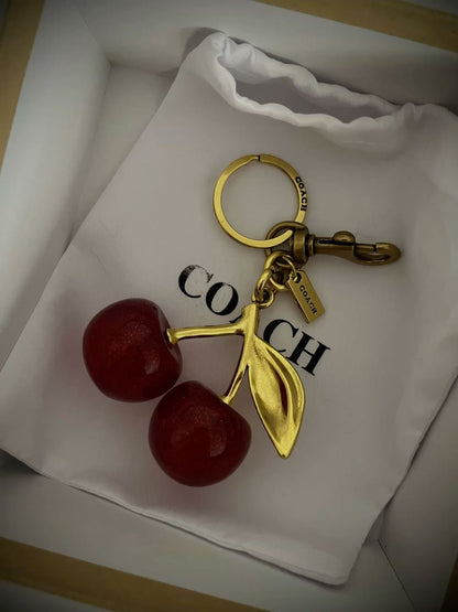 Coach cherry bag charm